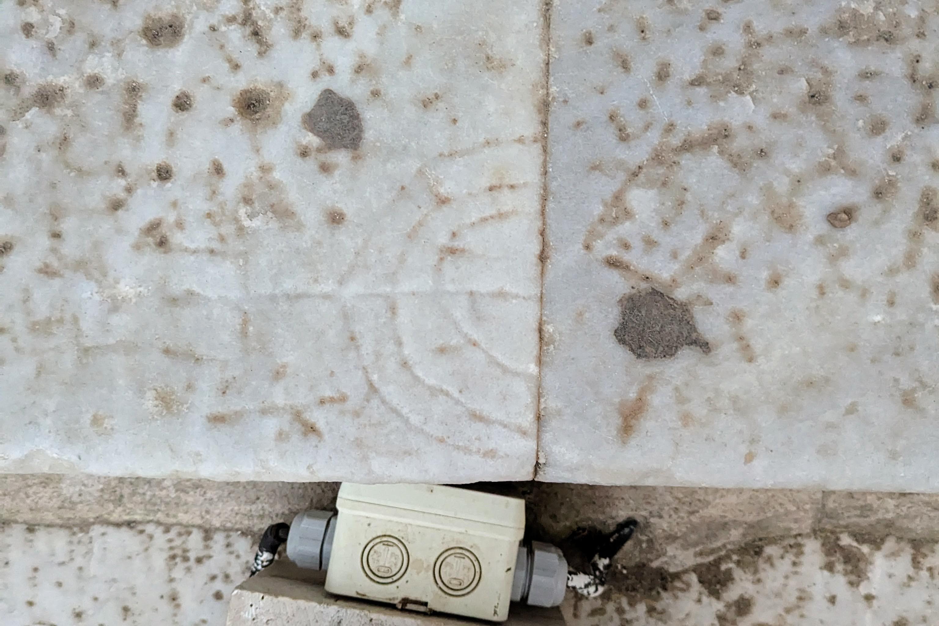 A menorah carved into the steps of the Library of Celsus