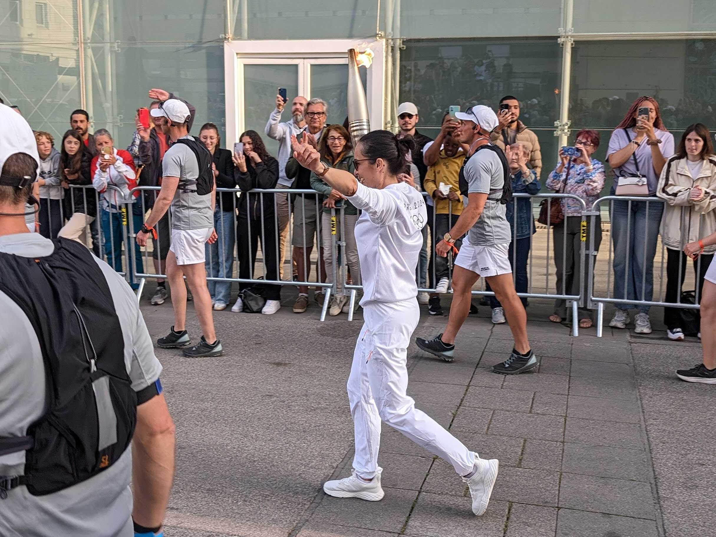 A relay runner carrying the Olympic torch